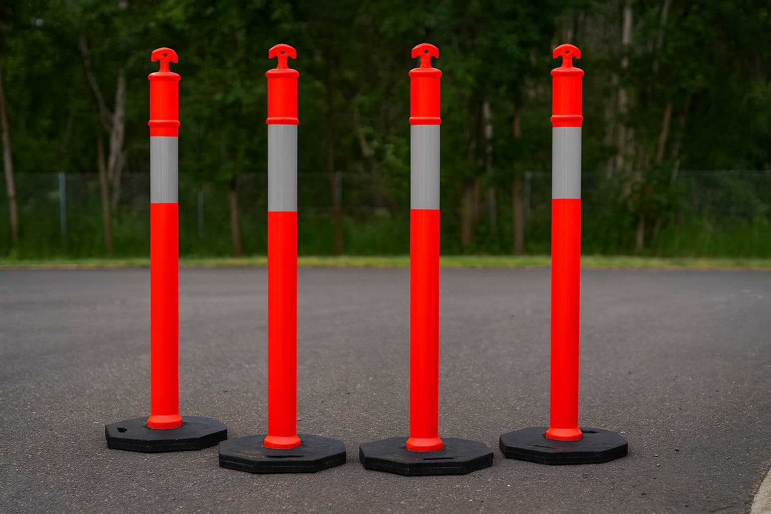Row of orange and white traffic bollards