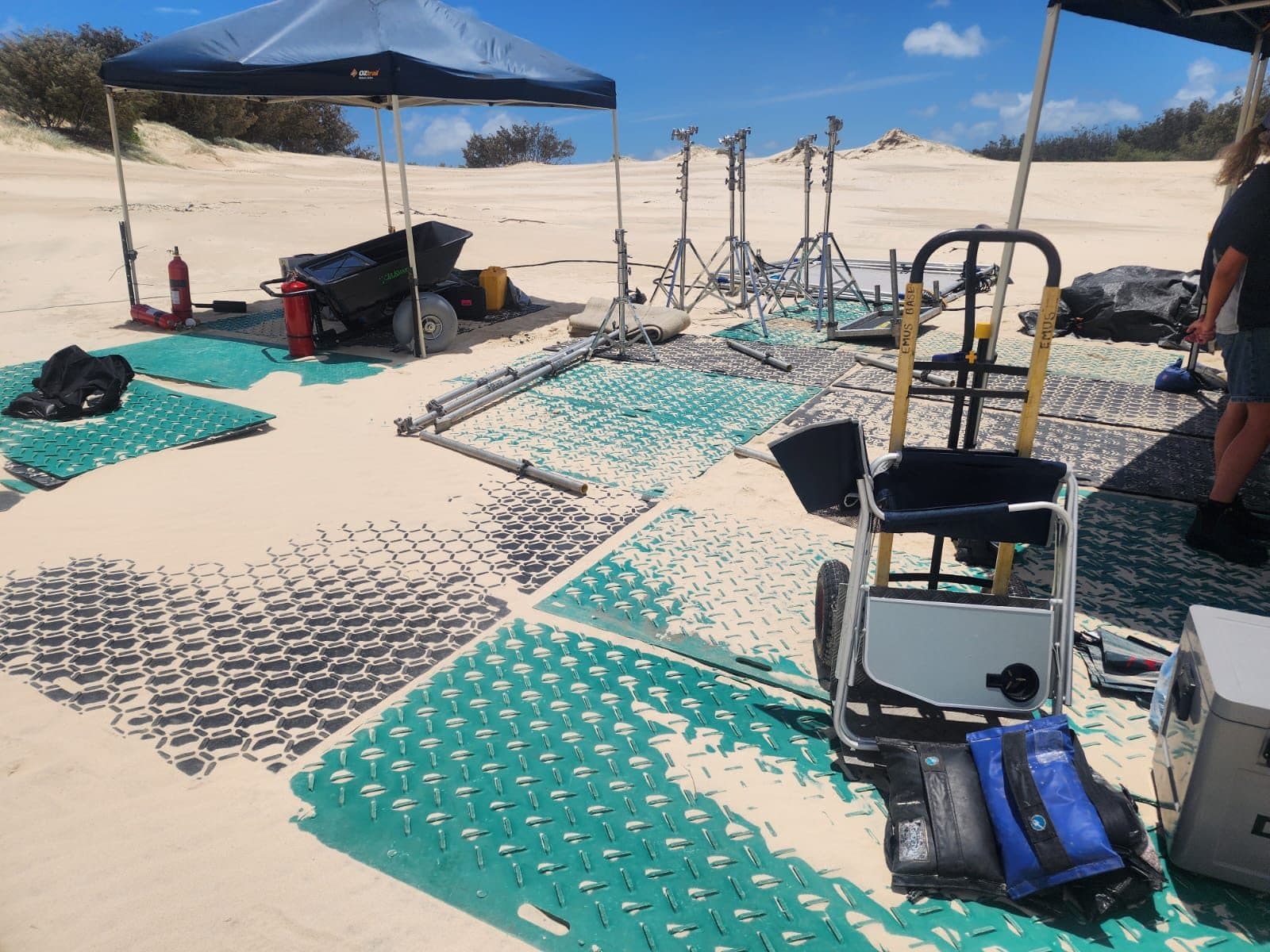 Track mats laid across sand to create site access